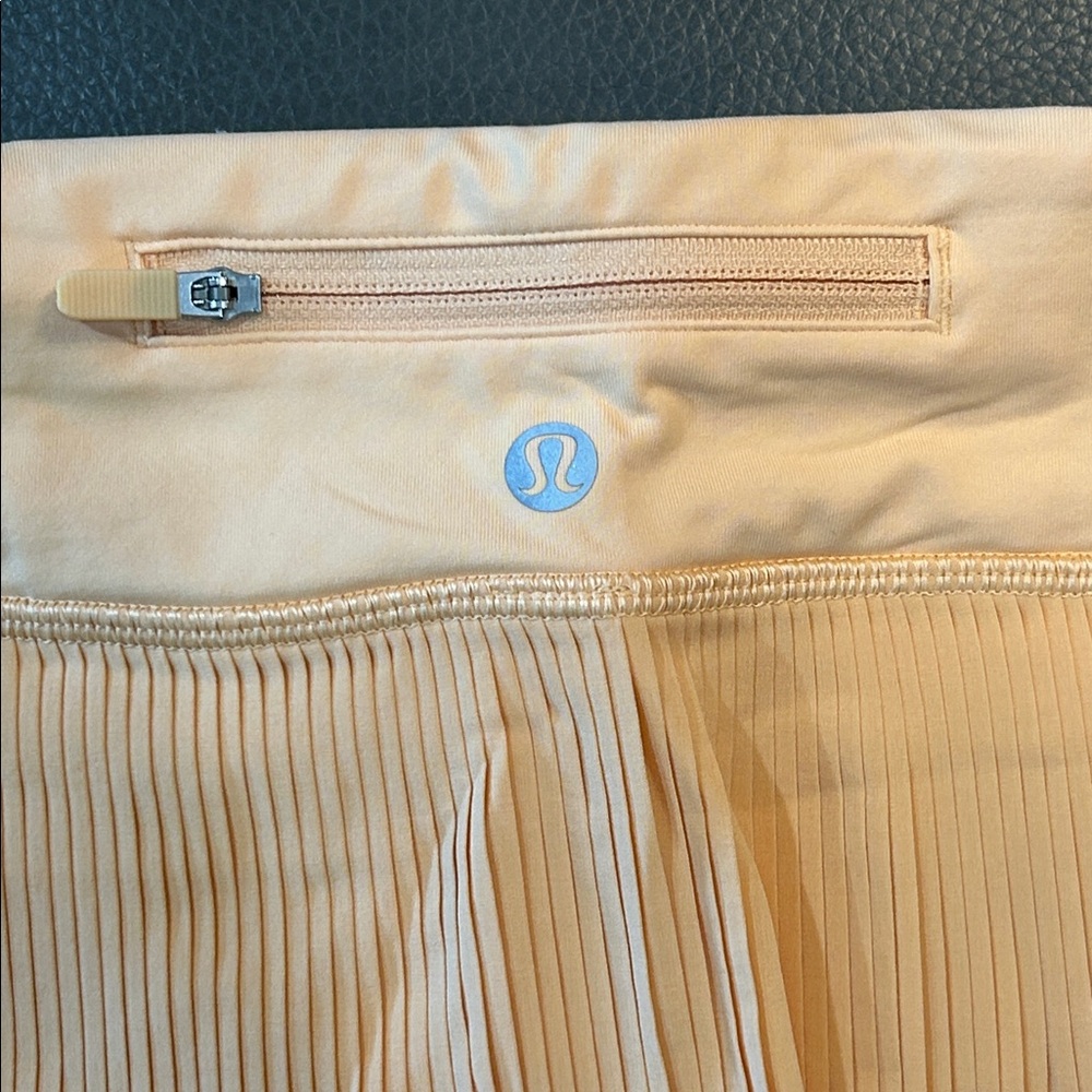 Lululemon Pleat to Street Mid-Rise Skirt in Summer Glow. Waist 28” - Picture 6 of 6